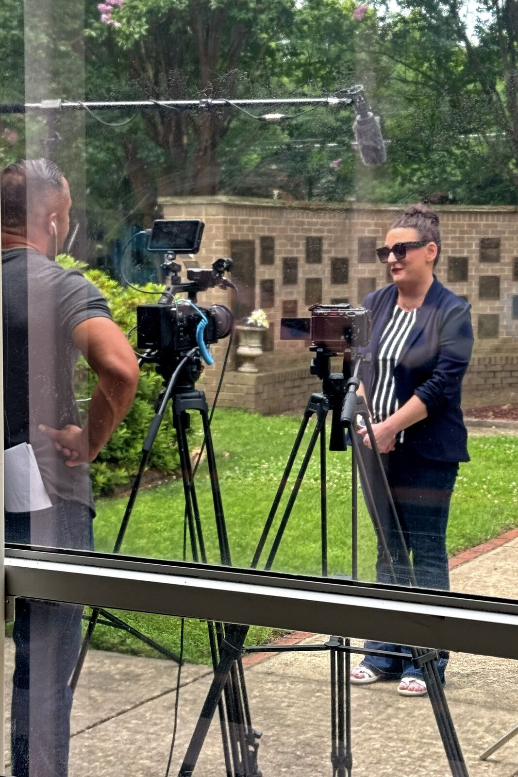 Rebecca Tarrant giving a television interview outdoors