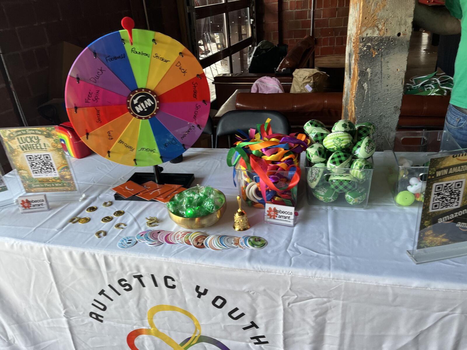 Prize wheel and fidget toys on an AYI activity table